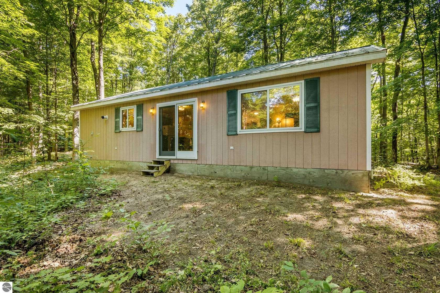 10 Acres of Recreational Land with Home for Sale in Mancelona, Michigan