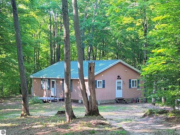 10 Acres of Recreational Land with Home for Sale in Mancelona, Michigan