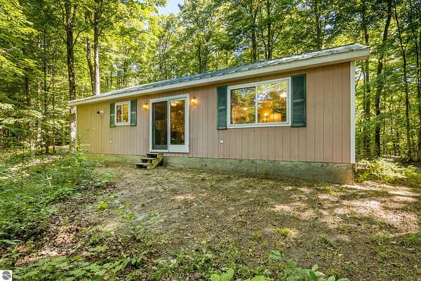 10 Acres of Recreational Land with Home for Sale in Mancelona, Michigan