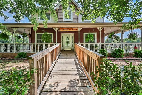 5.6 Acres of Land with Home for Sale in Adams, Tennessee