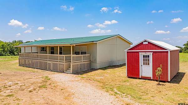 7.25 Acres of Land with Home for Sale in Dike, Texas