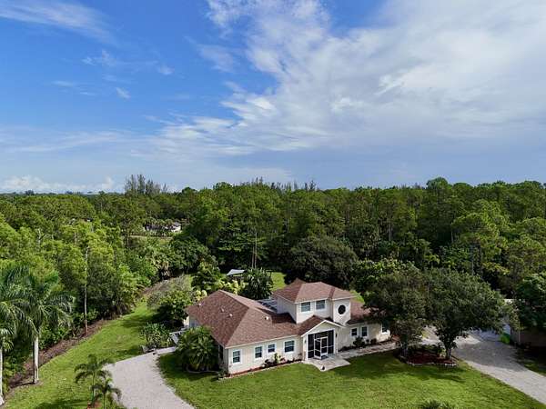 1.84 Acres of Land with Home for Sale in Loxahatchee Groves, Florida
