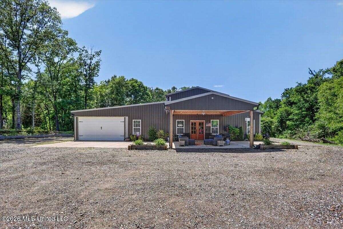 8.2 Acres of Land with Home for Sale in Coldwater, Mississippi