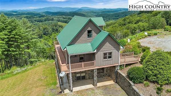 20.4 Acres of Land with Home for Sale in Grassy Creek, North Carolina