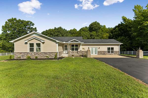 9.16 Acres of Land with Home for Sale in Hohenwald, Tennessee