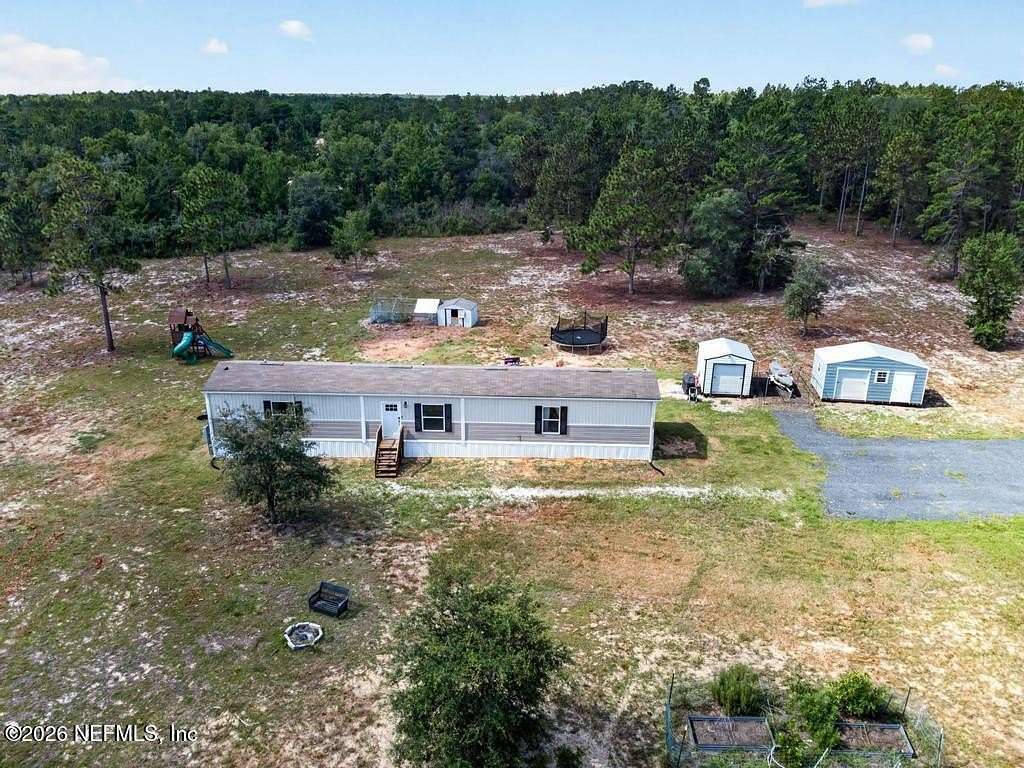 4.63 Acres of Land with Home for Sale in Interlachen, Florida