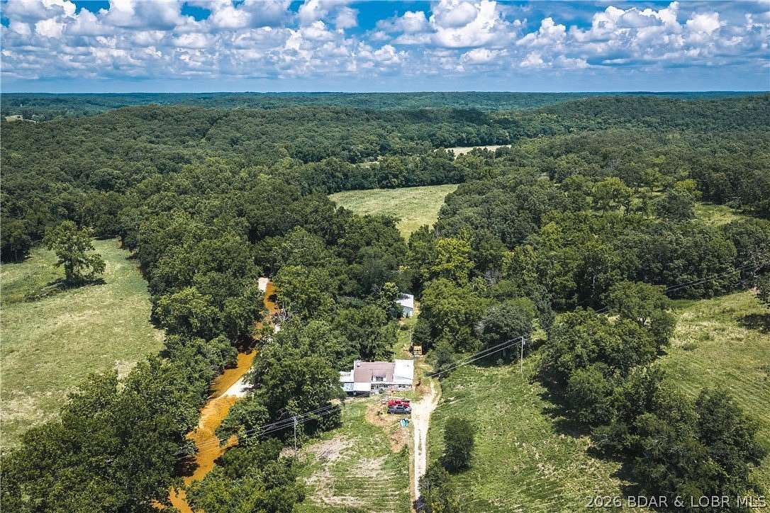 5.84 Acres of Land with Home for Sale in Macks Creek, Missouri