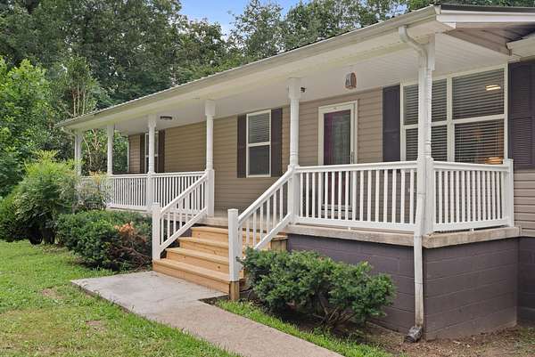 1.5 Acres of Land with Home for Sale in Charlotte, Tennessee