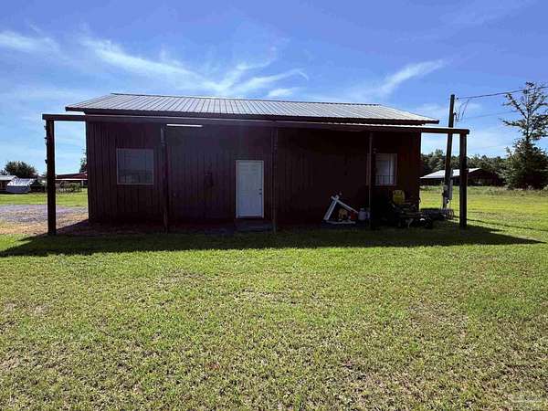 7.86 Acres of Land with Home for Sale in Jay, Florida