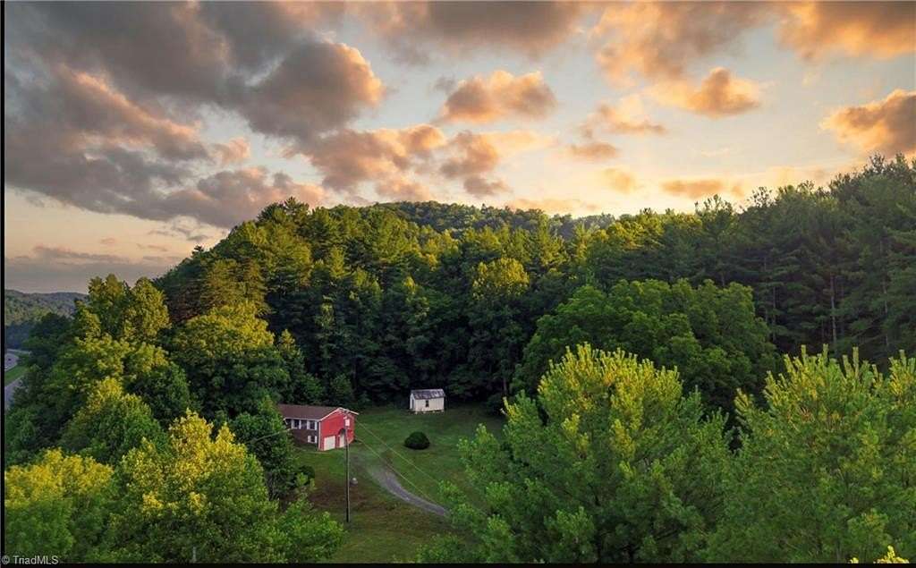 11.2 Acres of Land with Home for Sale in Purlear, North Carolina