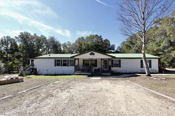 2 Acres of Land with Home for Sale in Laurel Hill, Florida