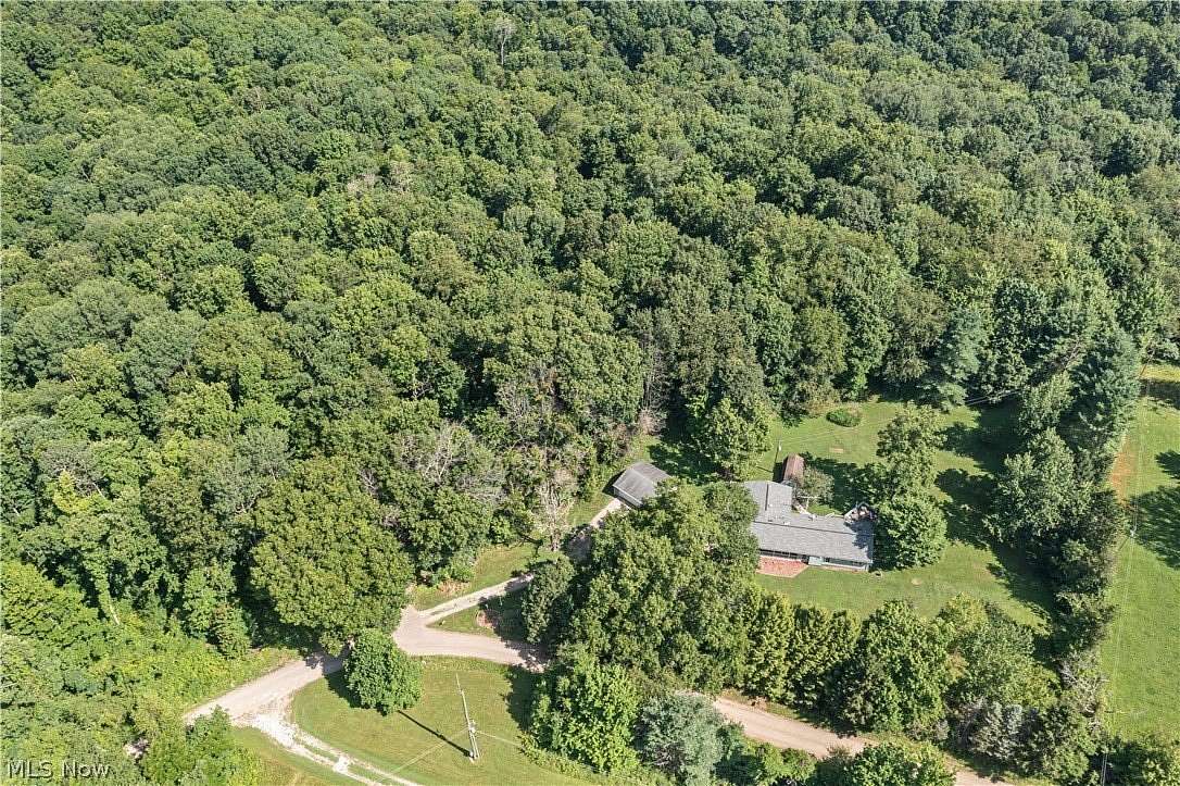 6.16 Acres of Land with Home for Sale in Kimbolton, Ohio