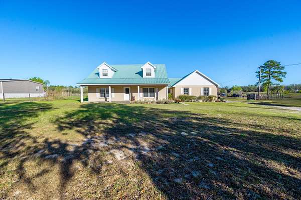 6.36 Acres of Land with Home for Sale in Bronson, Florida