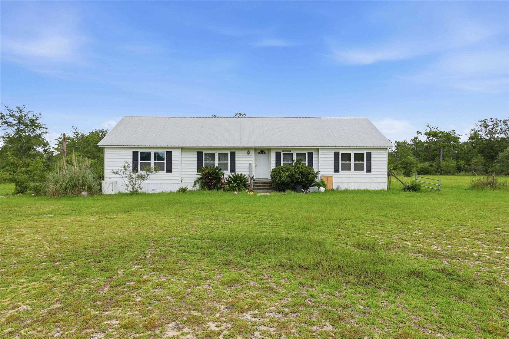 10 Acres of Land with Home for Sale in Altha, Florida