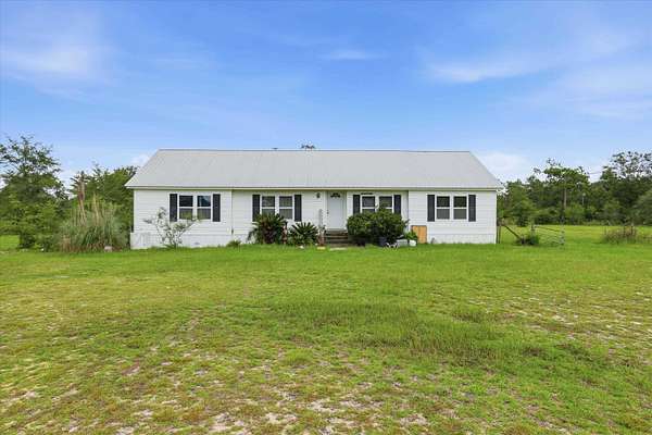 10 Acres of Land with Home for Sale in Altha, Florida
