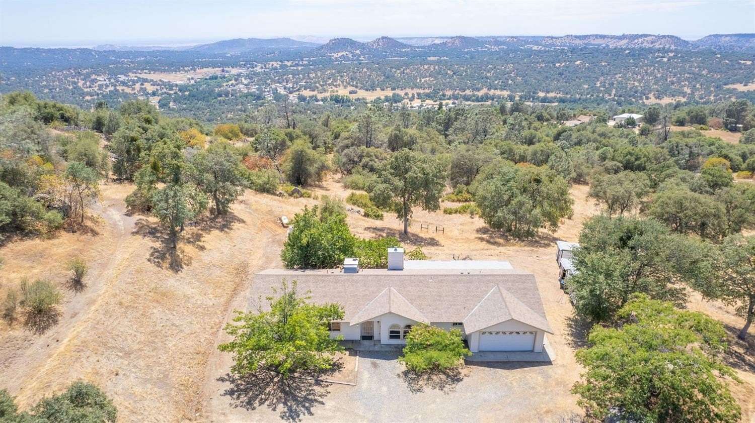 12.3 Acres of Land with Home for Sale in Auberry, California