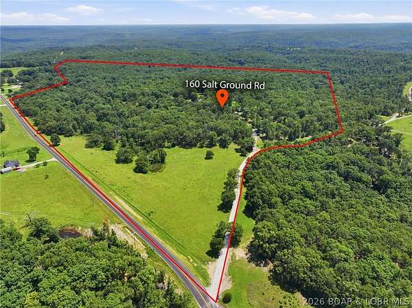 54 Acres of Land with Home for Sale in Macks Creek, Missouri