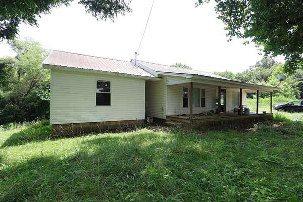 5 Acres of Land with Home for Sale in Buena Vista, Tennessee