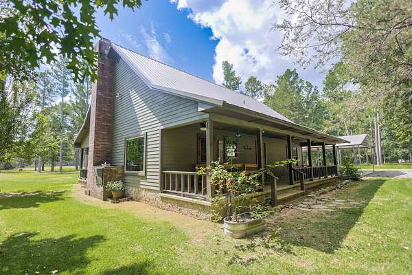5.78 Acres of Land with Home for Sale in Story, Arkansas
