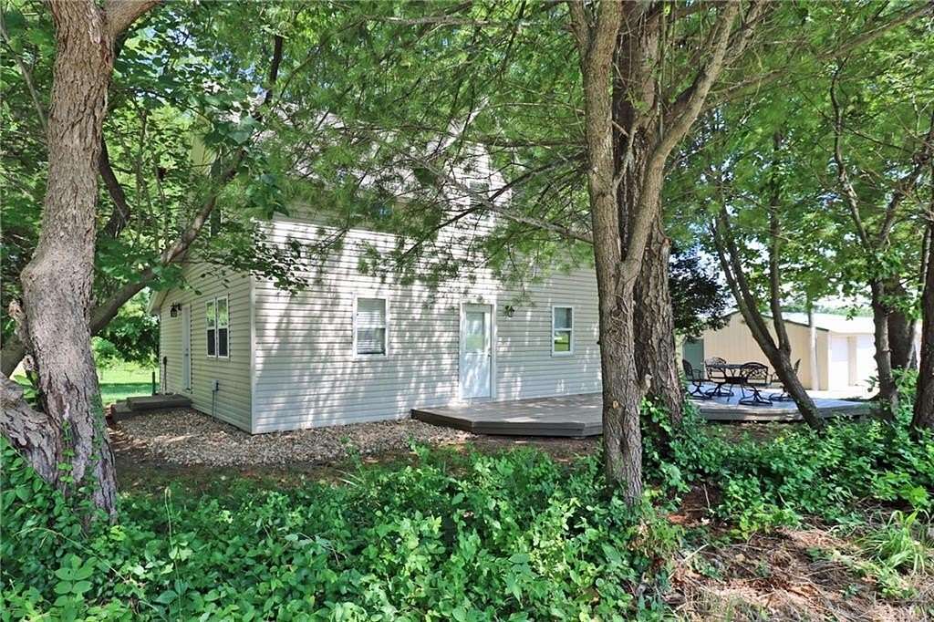 9.9 Acres of Land with Home for Sale in Harrisonville, Missouri