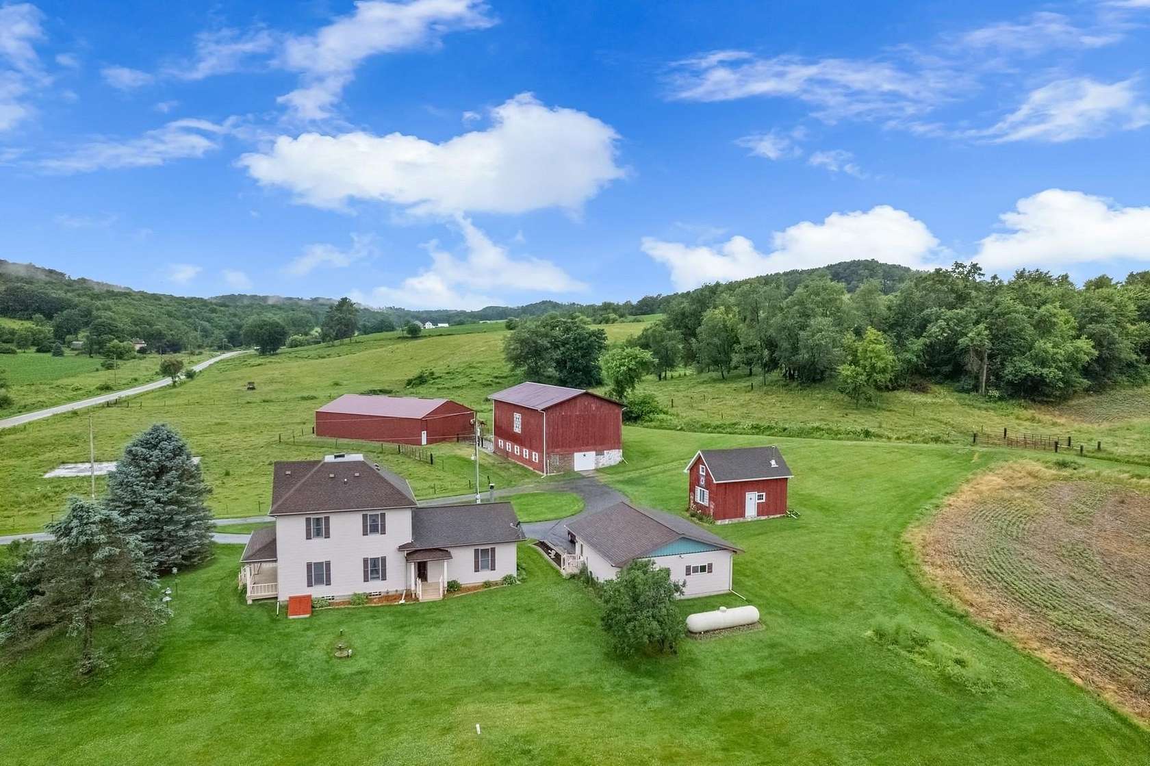 79.8 Acres of Agricultural Land with Home for Auction in Elroy, Wisconsin