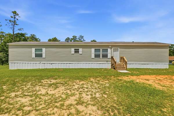 2.34 Acres of Land with Home for Sale in Holt, Florida