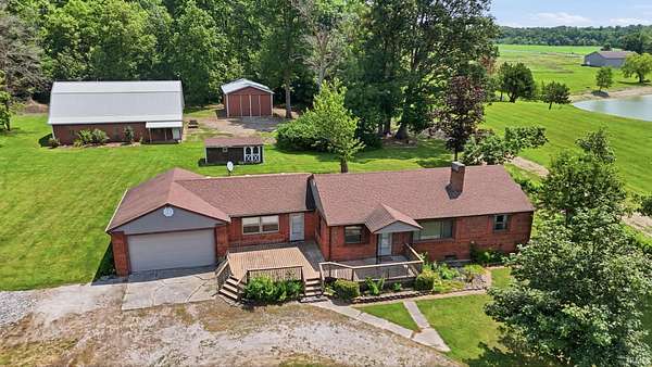 11 Acres of Land with Home for Auction in Ossian, Indiana