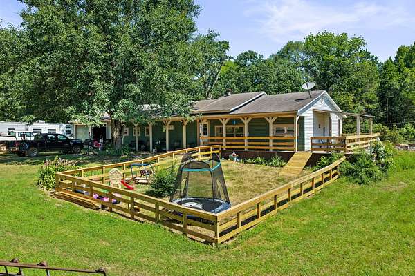 21.3 Acres of Land with Home for Sale in Hughes Springs, Texas