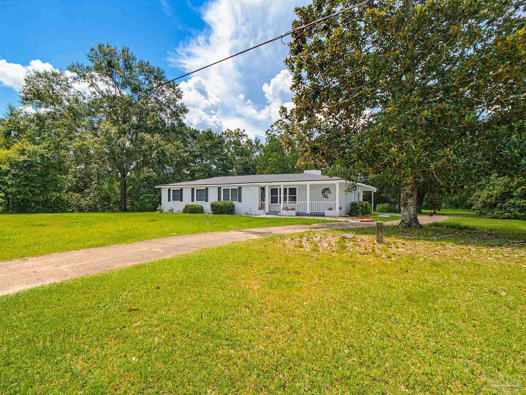6.62 Acres of Land with Home for Sale in Molino, Florida