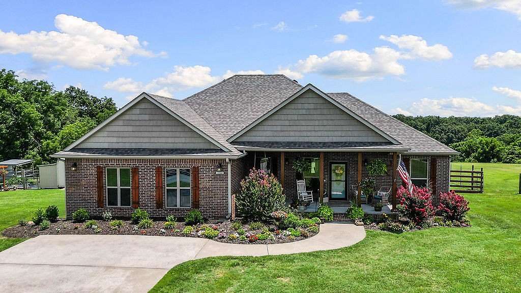 7 Acres of Land with Home for Sale in Gravette, Arkansas