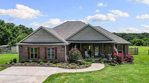 7 Acres of Land with Home for Sale in Gravette, Arkansas