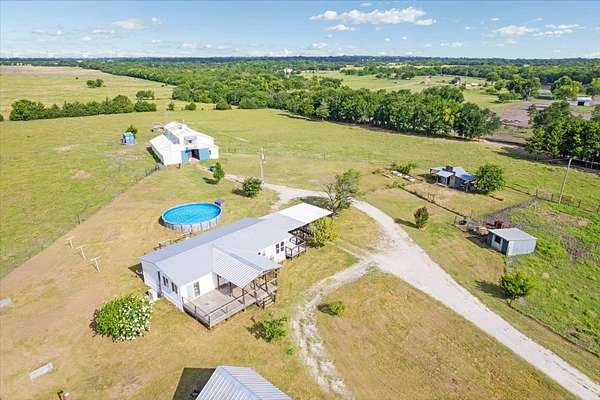 20.6 Acres of Land with Home for Sale in Wolfe City, Texas
