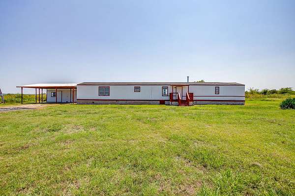 4.4 Acres of Land with Home for Lease in Grandview, Texas