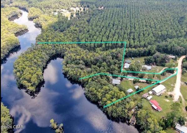 6.76 Acres of Land with Home for Sale in Ebro, Florida