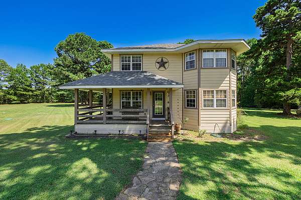 8 Acres of Land with Home for Sale in Atlanta, Texas