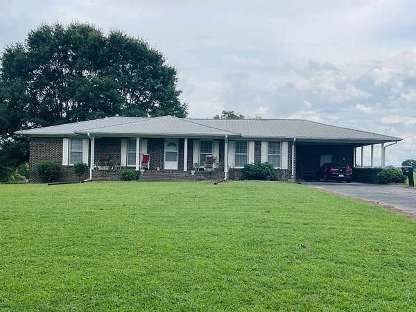 7 Acres of Land with Home for Sale in Holly Pond, Alabama