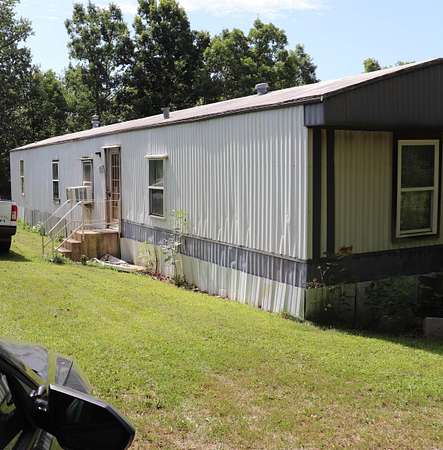 5 Acres of Land with Home for Sale in Mammoth Spring, Arkansas