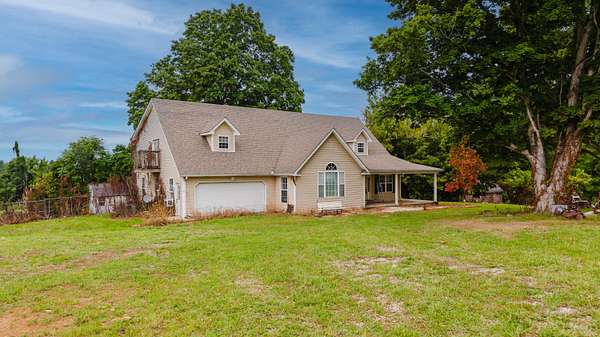 5.77 Acres of Land with Home for Auction in Scottsville, Kentucky