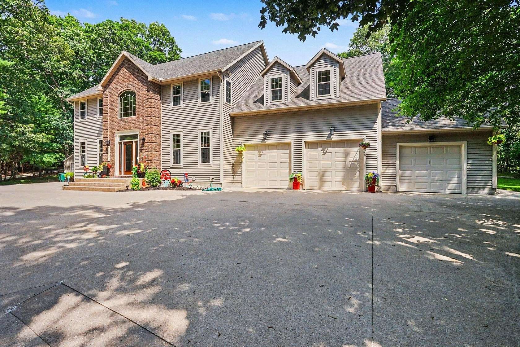 1.89 Acres of Land with Home for Sale in Norton Shores, Michigan