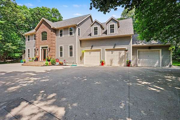 1.89 Acres of Land with Home for Sale in Norton Shores, Michigan