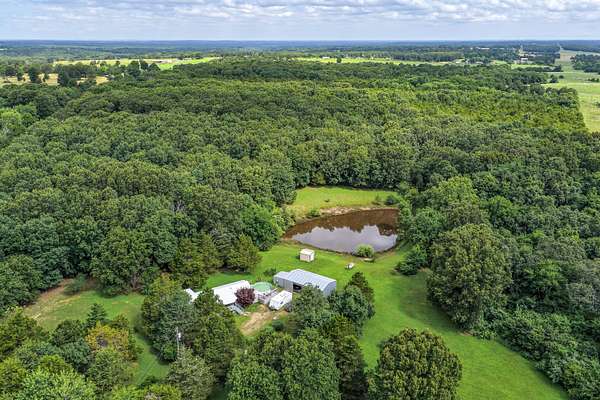 23.9 Acres of Land with Home for Sale in Hartville, Missouri