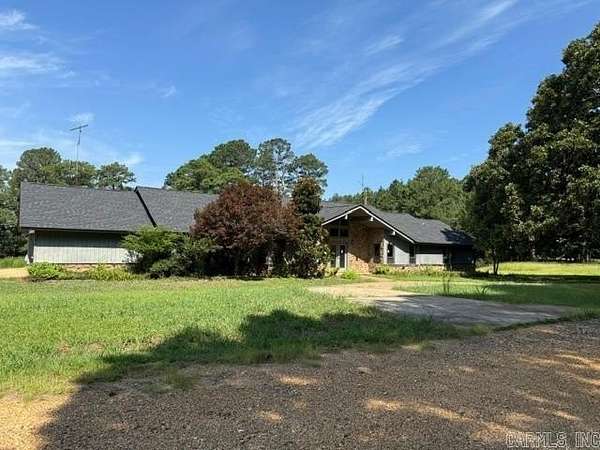 10.7 Acres of Land with Home for Sale in Stephens, Arkansas