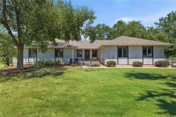 2.89 Acres of Land with Home for Sale in Raymore, Missouri