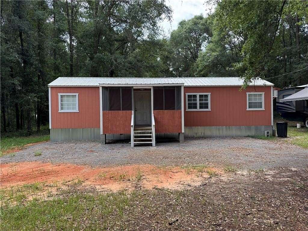 0.92 Acres of Land with Home for Sale in Eight Mile, Alabama