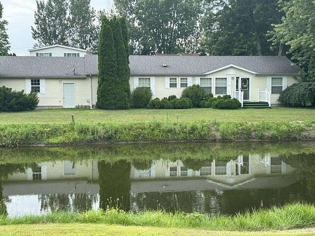 2.33 Acres of Land with Home for Sale in Eau Claire, Michigan
