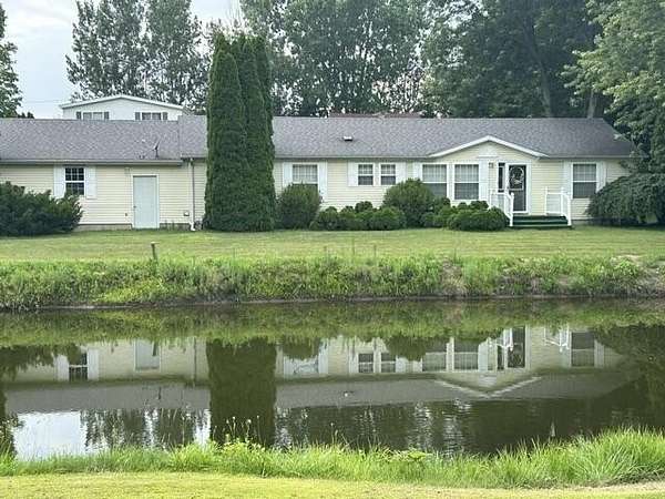 2.33 Acres of Land with Home for Sale in Eau Claire, Michigan