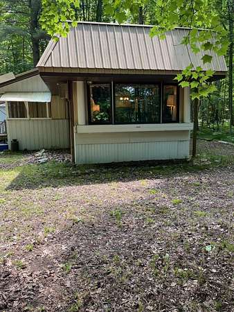 9.5 Acres of Land with Home for Sale in Brethren, Michigan