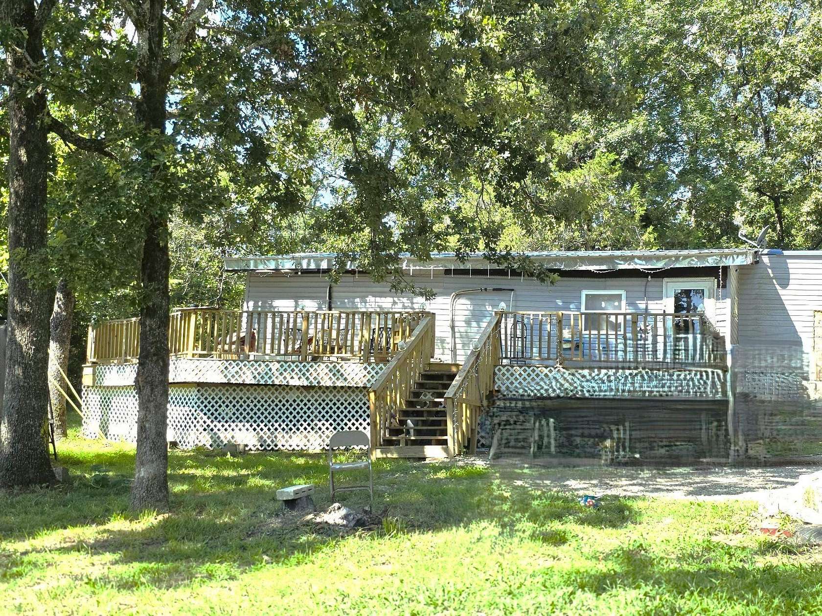 13.5 Acres of Land with Home for Sale in Calico Rock, Arkansas