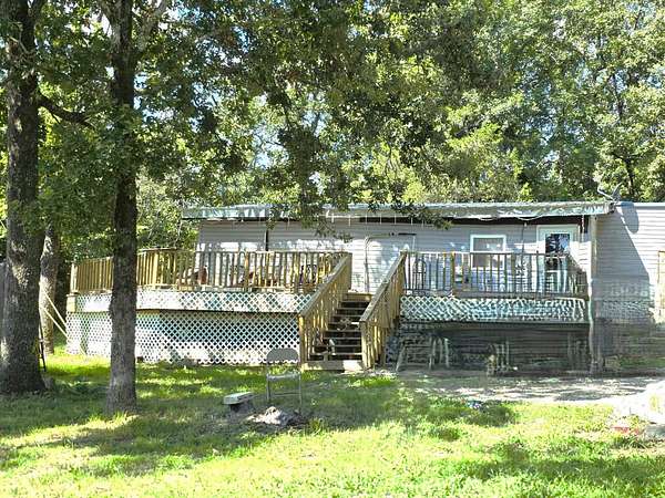 13.5 Acres of Land with Home for Sale in Calico Rock, Arkansas