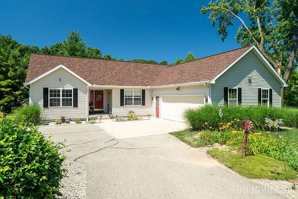1.5 Acres of Land with Home for Sale in Rockford, Michigan